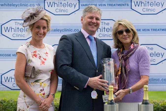 Prof Mark Whiteley and Vicki Smith presenting trophy to Julia Aisbitt owner of Malabar at The Whiteley Clinic stakes at Goodwood 2014