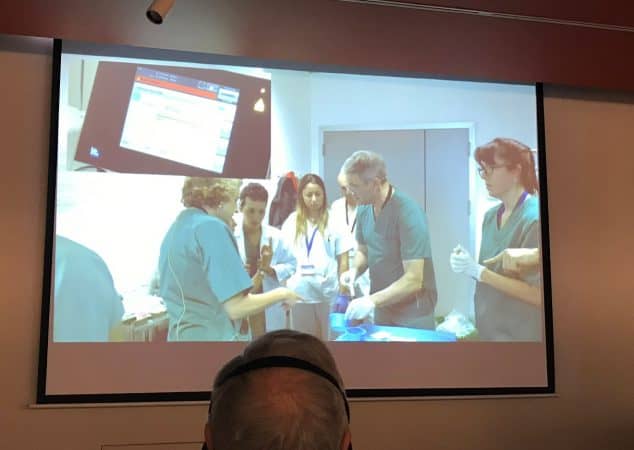 Prof Mark Whiteley and Vascular Technologist Eluned (Lyn) Davies operating live on a patient with varicose veins and a leg ulcer in Madrid - November 2018