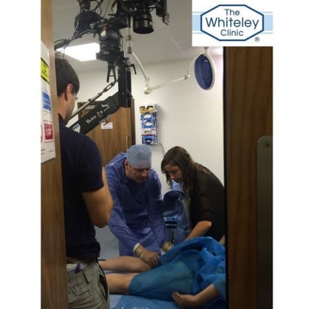 Prof Mark Whiteley and Producer Emily Rudge preparing a scene during the Filming of Blue Roses - a Marianna Simnett Film at The Whiteley Clinic in Bond Street, London